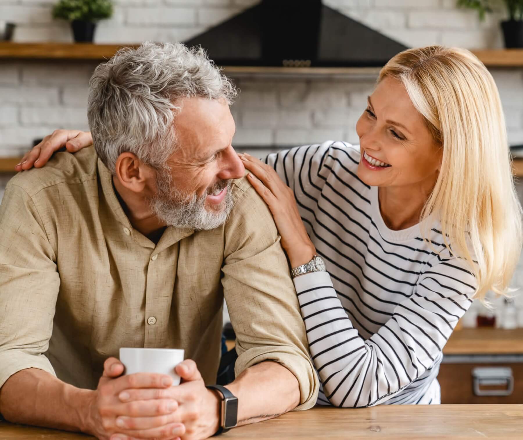 Couple in kitchen.