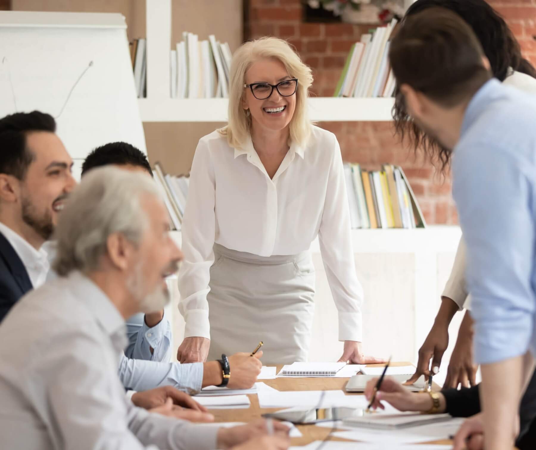 Woman leading meeting in conference room.