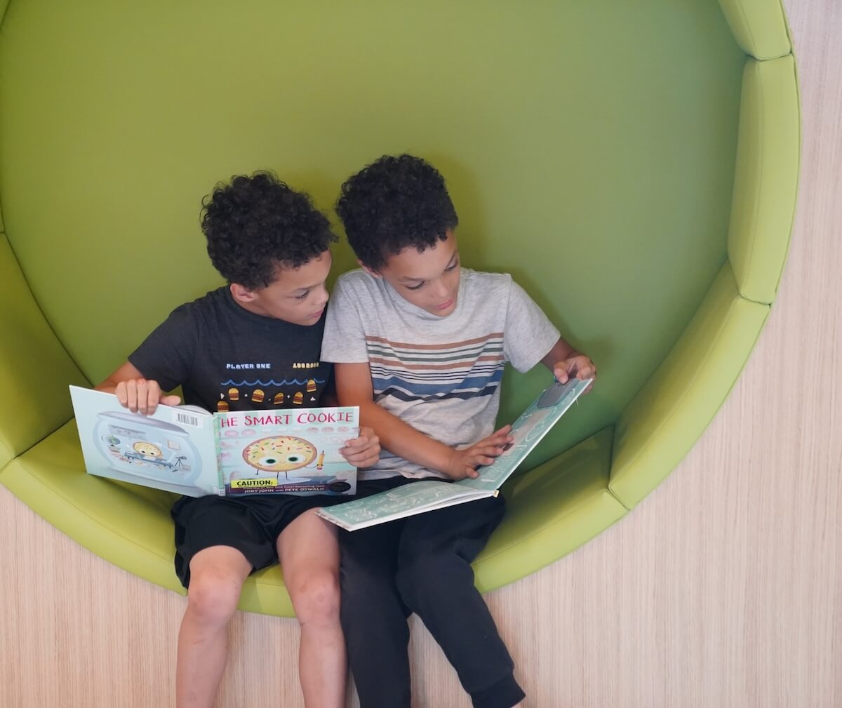 Children reading at library